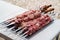 Raw meat on skewers for cooking kebabs on grill