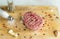 Raw meat steaks with spices on the kitchen Board, pepper, garlic, juice, food