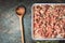 Raw Meat stuffing with rice and minced meat with cooking spoon