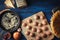 Raw meatball and spaghetti with different ingredients on the blue wooden background