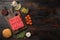 Raw meatballs burger or sandwich ingredients with sesame buns, on old dark  wooden table background, top view flat lay, with copy