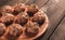 Raw meatballs, with micro greenery, on a cutting board, homemade, rustic, no people,