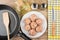 Raw meatballs in plate, frying pan with spatula, vegetable oil