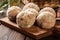 Raw meatballs rolled in a crispy bun prepared for baking