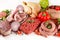 Raw meats on white background- roast beef, sausage, minced beef, chicken, lamb chop