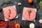 Raw mince meat cutlet, ground beef and pork. Burger patties. Black background. Top view