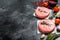 Raw mince meat cutlet, ground beef and pork. Burger patties. Black background. Top view. Copy space