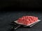 Raw minced beef on light gray cement background