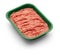 Raw minced meat in a green tray on white background