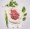 Raw minced meat with herbs on paper and garlic wooden rustic background top view