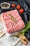 Raw minced pork on a chopping Board. Organic ground meat, forcemeat. White background. Top view