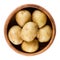 Raw mini potatoes in wooden bowl over white