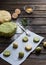 Raw mint and orange chip cookies on wooden table. Color dough. Mint cookies. Orange cookies. Process of baking. Homemade bakery.