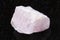 raw morganite (pink beryl) crystal on dark