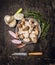 Raw Mushrooms in bowl with thyme , fresh garlic , onions and vintage knife