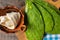 Raw nopal cactus and oaxaca cheese on wooden background