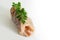 raw northern pike steaks in a row with parsley garnish, fresh fish prepared for grilling or frying, bright gray background fading