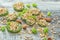 Raw oatmeal, dried kiwi and almond on wooden background