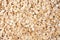 Raw oats wooden cutting board background.
