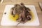 Raw octopus on a cutting board