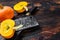 Raw orange pumpkins. Dark wooden background. Top view. Copy space