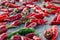 Raw organic chili red peppers on wooden background