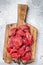Raw organic diced lamb meat for cooking Goulash. Gray background. Top view