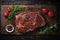 Raw organic marbled beef steaks with spices on a wooden cutting board on a black background