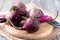 Raw organic red beets on wooden table