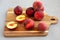 Raw Organic Yellow Peaches on a wooden board, side view