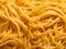 raw organic yellow spaghetti ready to cook