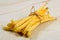 Raw Organic Yellow String Beans in a bunch on white background. Organic yellow wax bean on a table