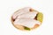 Raw parts of turkey wing, three pieces of chicken, with limes and parsley on a white background, isolate.