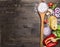 Raw pasta with tomatoes, basil,parmesan and oil, cooking Ingredients on rustic wooden background, top view, place for text