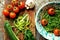 Raw pasta with zucchini and spinach pesto with tomatoes