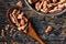 Raw Pecans on a Wood Spoon