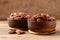 Raw peeled pecan nuts in wooden bowl on wooden background