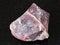 raw pink Flint stone (Chalcedony) on black