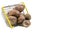 Raw pink potato tubers in a shopping basket on a white isolated background.Potatoes in the skin