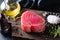 Raw pink tuna fillet on a wooden background