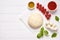 Raw pizza dough with baking recipe ingredients: mozzarella, tomatoes sauce, basil, olive oil, cheese, spices. Italian