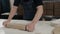 Raw pizza ingredients on wooden table, chef cooking pizza for delivery