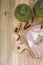 Raw pork ,ceramic pots, rosemary and spices on a wooden board on