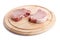 Raw pork chops on chopping board