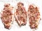 Raw pork chops with spices on a light background, top view. Ingredient food