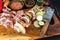 Raw pork chunks skewered on steel sticks. Preparing for summer barbecue. Freshly prepared colorful meat kebabs with  onion and