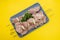 Raw pork meat with onion and herbs on iron stick