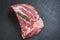 Raw pork ribs meat on black plate background - Fresh pork spare ribs for cooking roasted or grilled , Pork bone with rosemary