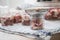 Raw pork shoulder in preserving screw-cap glass jars and metal funnel on towel for home-made pressure canning meat as Russian