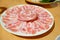 Raw Pork Slice in White Round Plate on Wooden Table. Shabu Japan